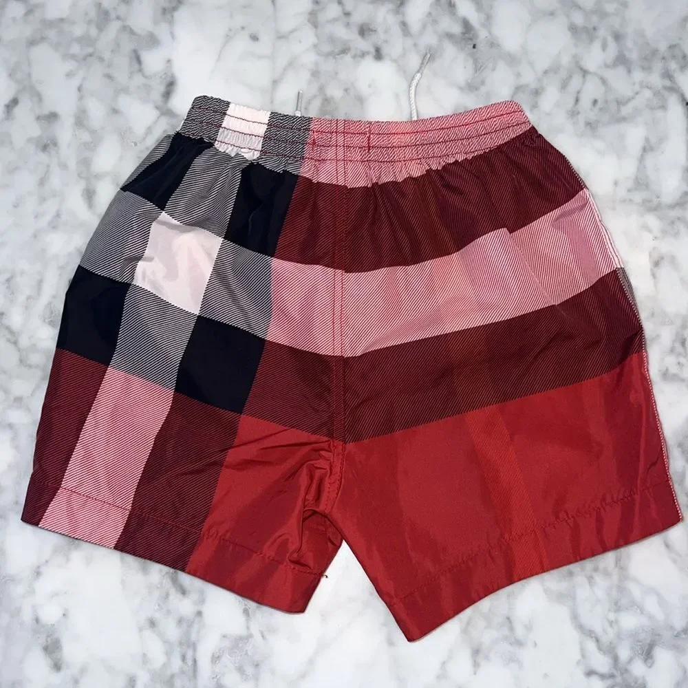 BURBERRY BOYS RED SWIM SHORTS 12M